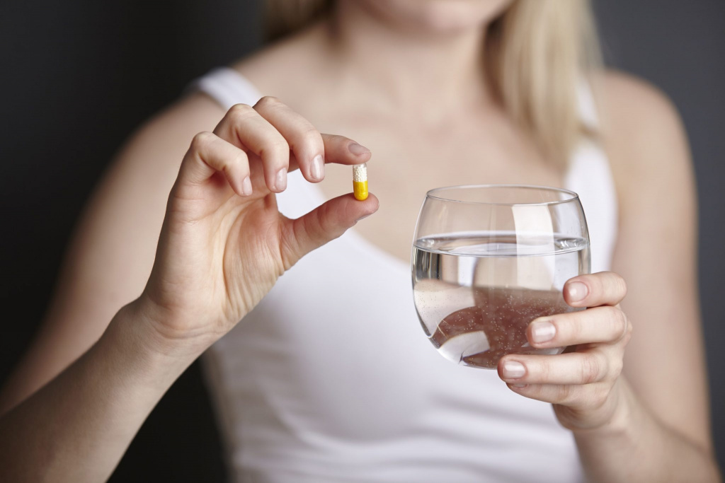 cropped-shot-of-young-woman-holding-medicine-capsule-and-glass-of-water-626541293-577cf39c3df78cb62c3ac6bc-2048x1365.jpg